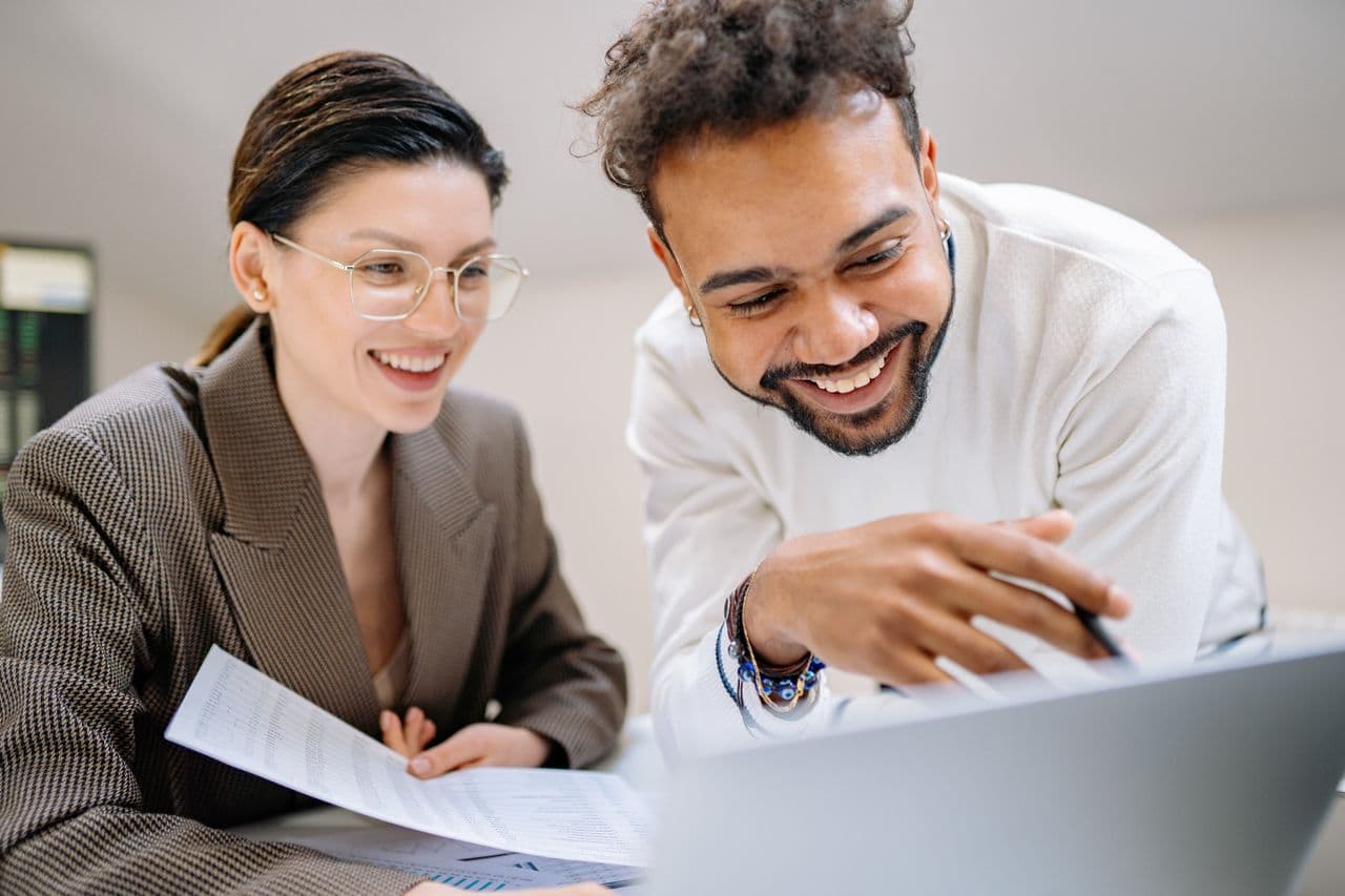 A client and adviser reviewing accounts together