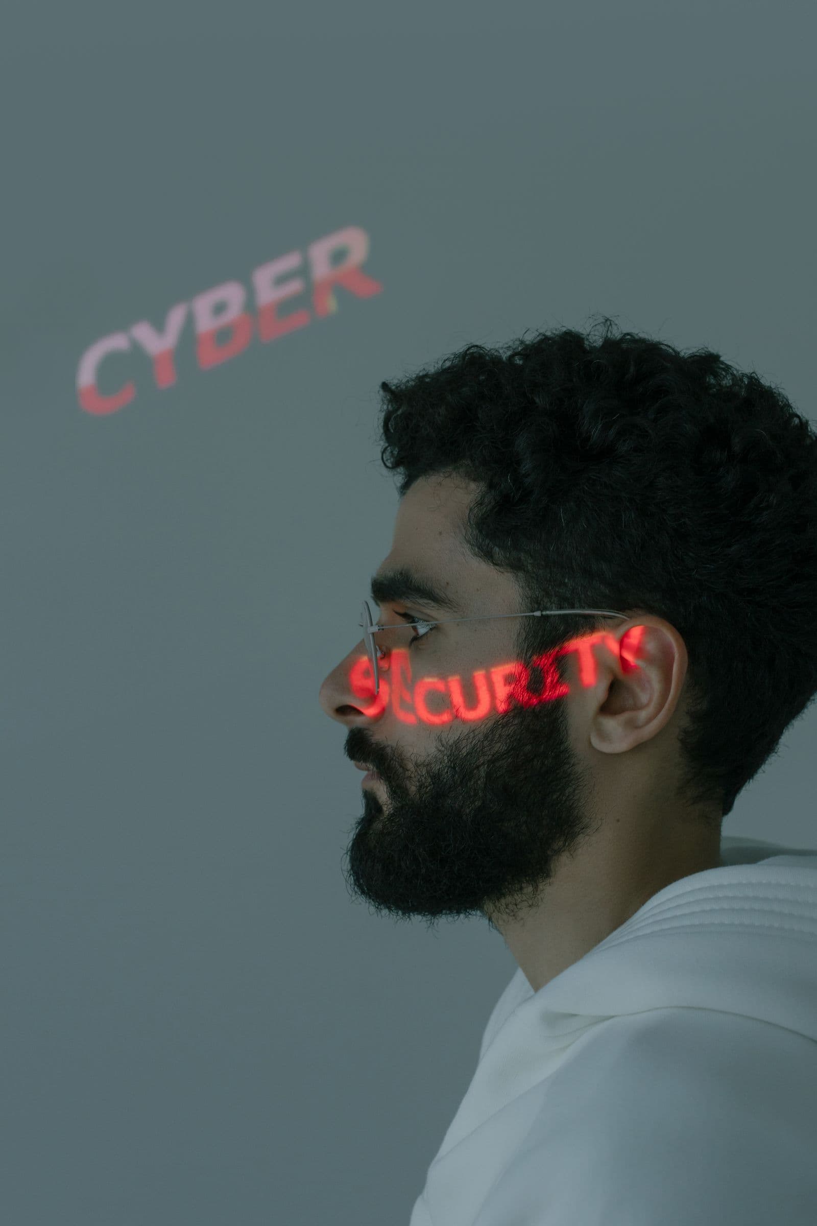 A moody portrait with the word security projected across it